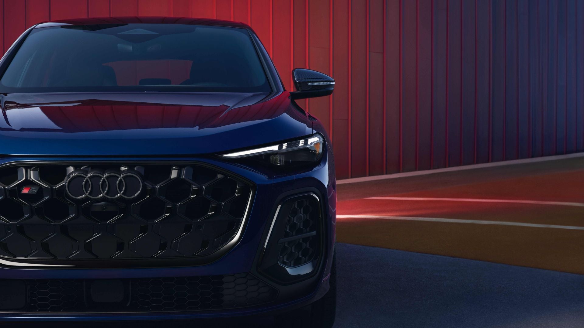Front profile view of an Audi SQ5 parked.